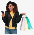 female model answering mobile phone and carrying shopping bag